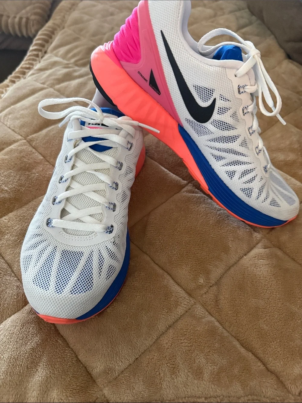 Nike Women's White Running Shoes with Blue and Pink Accents